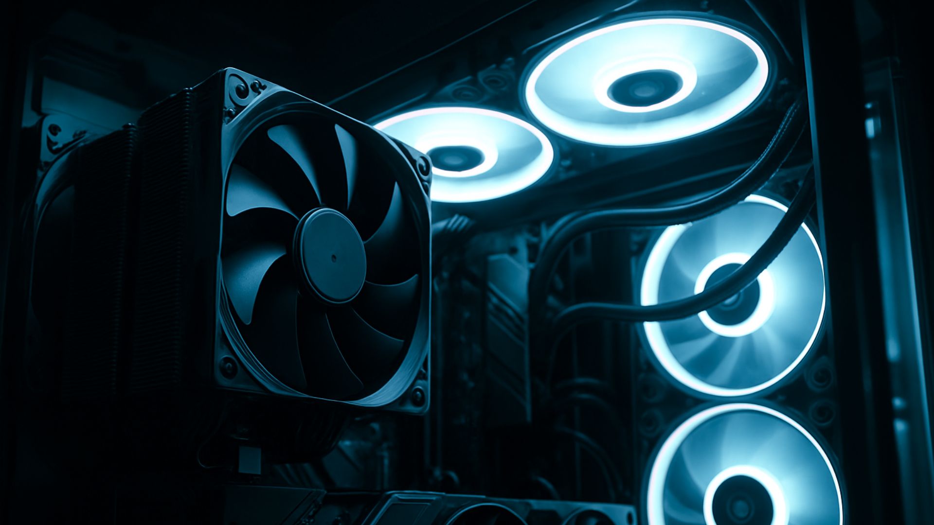 Side-by-side view inside a gaming PC case showing a large air cooler on the left and a 360mm AIO liquid cooler on the right, lit with blue RGB lighting